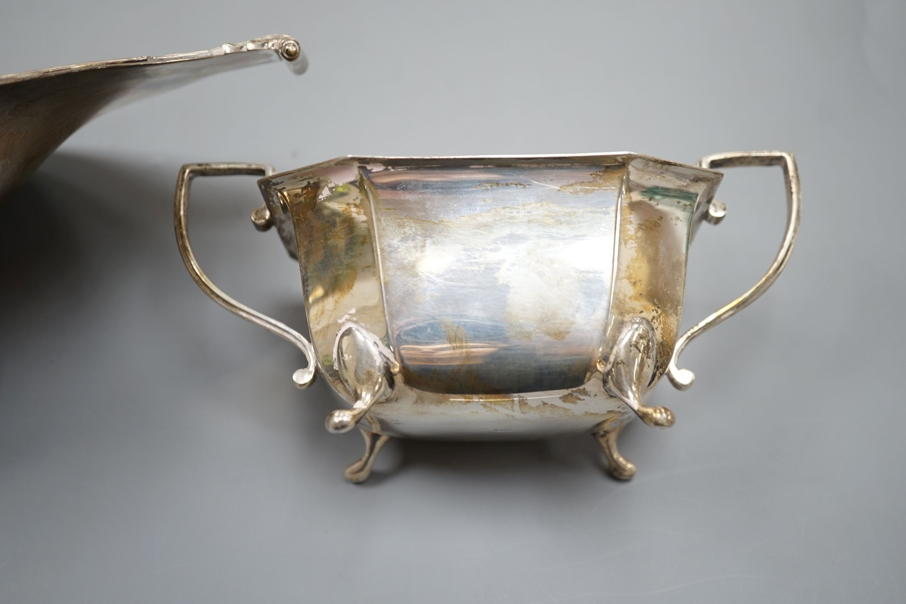 An Edwardian silver two handled fruit bowl, R & S Sorley, London, 1908, 31.9cm and a later two handled sugar bowl, 20.5oz.